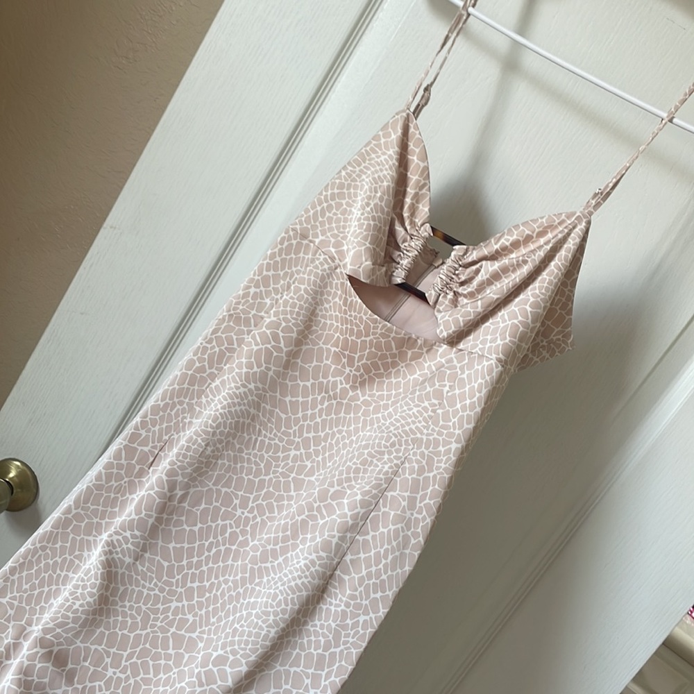 Silk mid dress. Pink. Very smooth and comfortable. Flows.